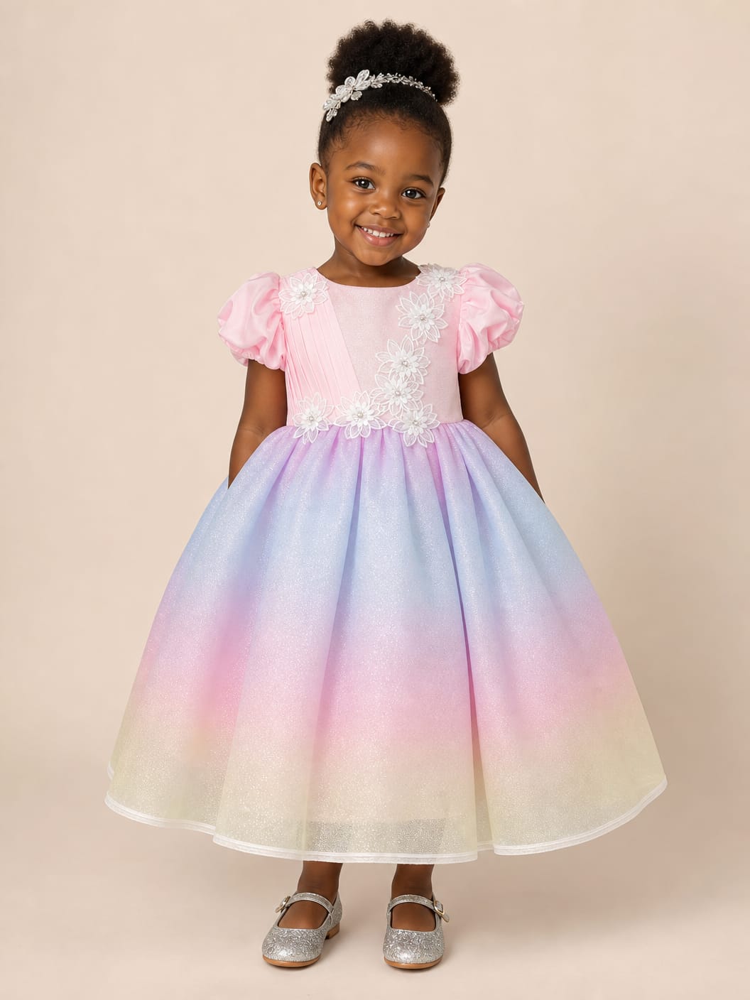 Little girl's pink and rainbow tulle party dress with floral bodice